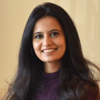 Ruta Deshpande rhaeos headshot crop 2